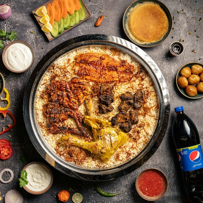 a plate of food with a variety of sauces and condiments